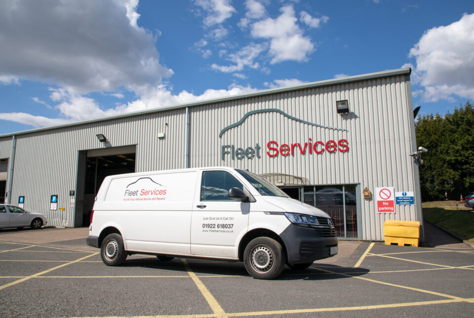 Van in front of Fleet services signage